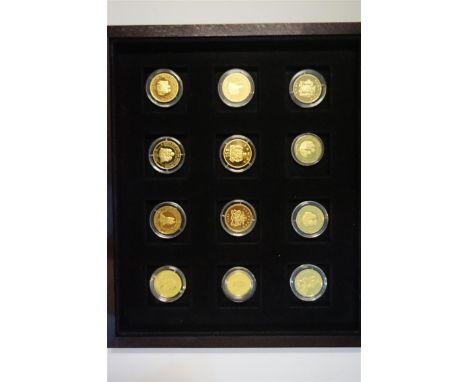 A cased set of twelve 14ct gold proof medals commemorating Her Majesty Queen Elizabeth the Queen Mother, issuing countries to