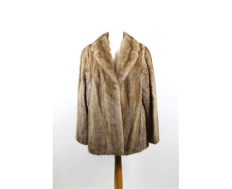 A circa 1970's long hip length blond mink jacket, with self lined collar, twin clip fastening to front and slit pockets, full
