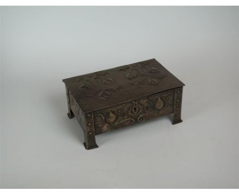 An Arts and Craft rectangular jewellery box, having plannished and repousse decoration of foliate entitled Rhos on Sea Golf C