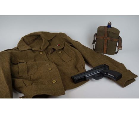 A British Army mid 20th century Major's battle dress blouse, with medal bars for 39-45 medal and Defence medal, Officers cap,