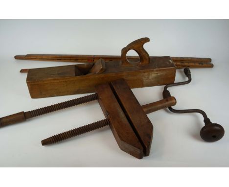 A large collection of early 20th Century woodworking tools, comprising approximately four braces, seven hand drills, spirit l