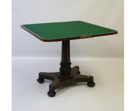 A Victorian rosewood veneered pedestal card table, the rectangular hinged and swivel top with rounded corners enclosing a bai