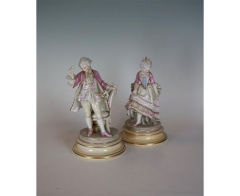 A pair of French Gillet & Brianchon porcelain figures, Circa 1890, each well modelled as an 18th Century nobleman and compani