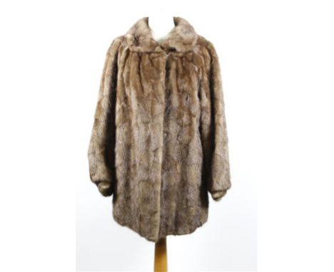 A circa 1960's brown mink swing coat, hip length with self lined collar, triple hook fastening to front, slip pockets and fla