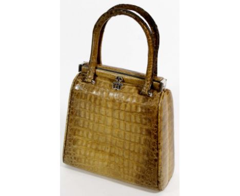 Two vintage circa 1960s crocodile skin handbags, the first with feature double fold clasp to twin D-handles, approx. 23cm wid