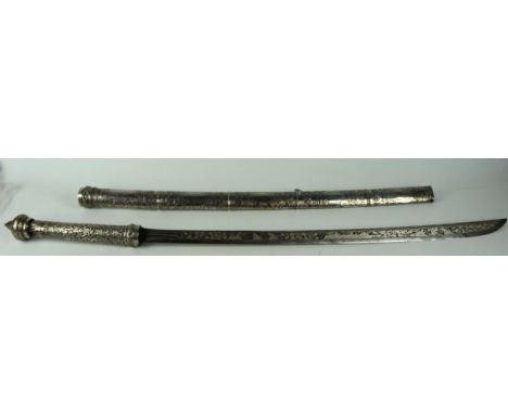 A late 19th century Burmese Dha, the 67cm curved single edged blade with extensive white metal decoration of fighting figures