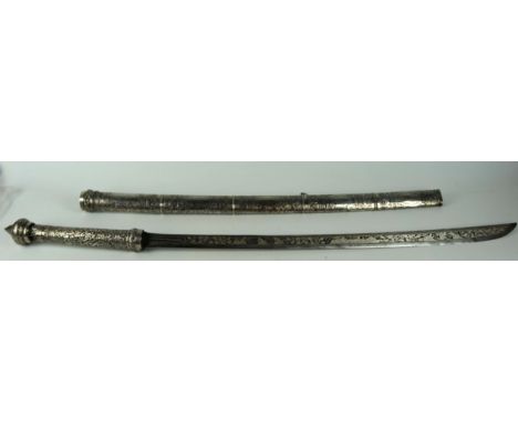 A late 19th century Burmese Dha, the 67cm curved single edged blade with extensive white metal decoration of fighting figures