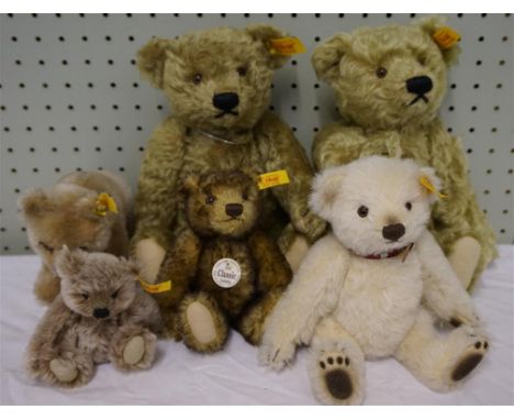 Six modern Steiff bears comprising two beige plush bears with glass eyes, pink felt paws and articulated limbs, no.713, heigh