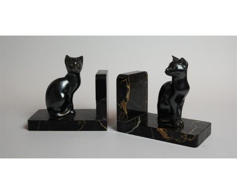 A pair of Art Deco bookends modelled with Spelter cats, raised on veined marble plinth bases, by M. Font, signed to rim, heig