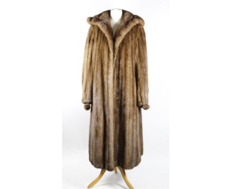 A circa late 1960's/early 1970's light brown mink fur coat, full length, having wide self lined collar, slit pockets, slightl