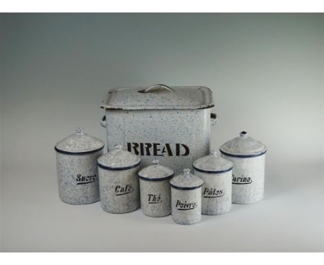 A collection of French enamel storage canisters, all with marbled and speckled blue decoration and cobalt rim and script titl
