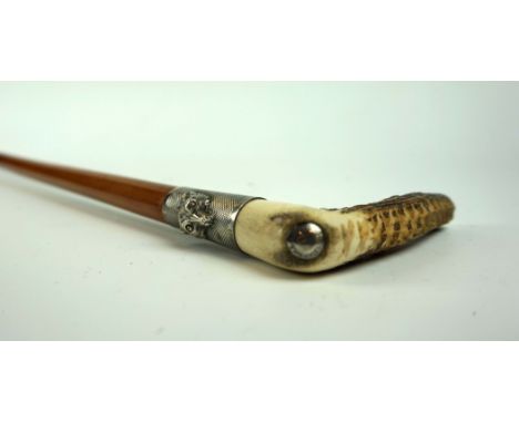 A late 19th Century Swaine & Adeney riding crop, with carved horn handle, and white metal engine turned ferrule cast with fox