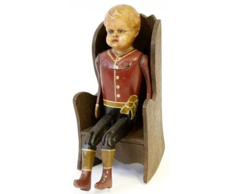 A 20th century celluloid headed doll with moulded hair and painted features with wooden jointed body in painted red jacket an