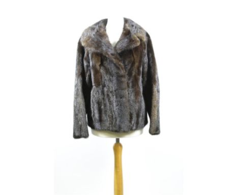 A circa 1970's brown mink hip length jacket, with self lined collar, twin hook fastening to front and slit pockets, fully lin