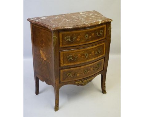 A fine quality French Louis XV revival commode of serpentine form, featuring a veined marble top with elegantly carved border