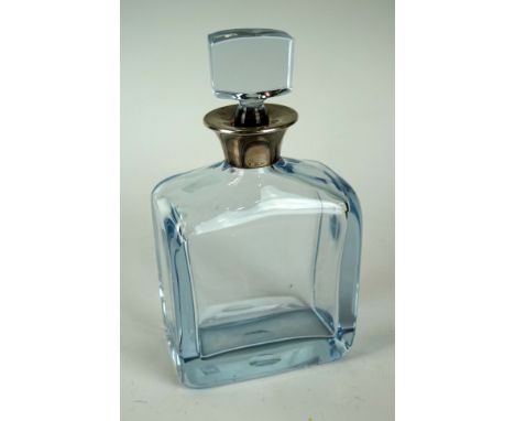 A good quality art glass decanter with a blue tinge to the clear glass with hallmarked silver collar, Birmingham 1980, height