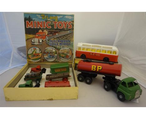 A boxed Triang minute toys clockwork scale model set, containing two cabs to form tractor units for transport wagon, minute b