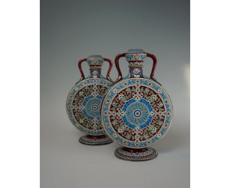 A pair of French Vieillard Bordeux pottery, Iznik type twin-handled moonflasks, Circa 1880-1900, each of typical flattened ci