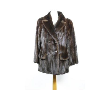 A circa 1960's chocolate brown ranch mink jacket, of fitted form with self lined double collar to double breasted button deta