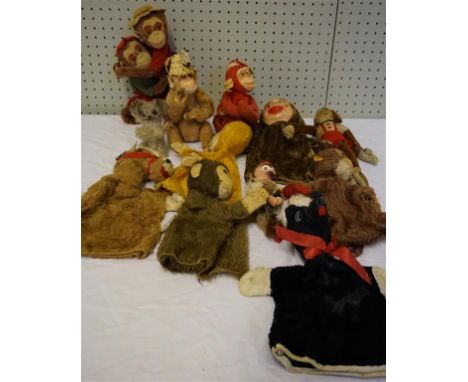 Four plush monkey glove puppets, three with felt faces and one with plastic face, a pair of brown plush cuddling monkeys with