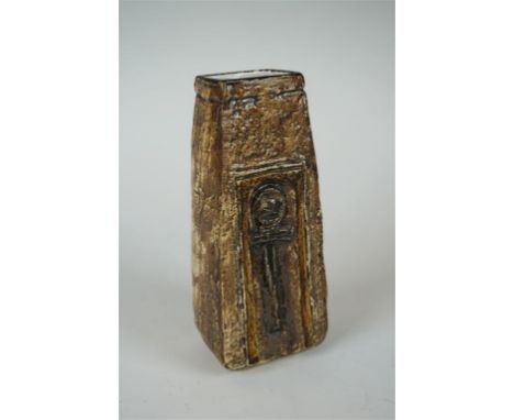 A Troika pottery Newlyn coffin vase, decorated in a manganese colour with a stick figure to centre, height 17cm, signed Troik