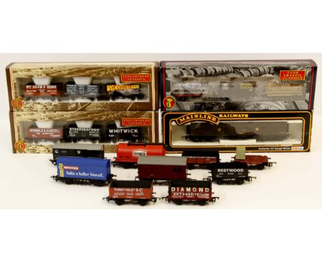 A quantity of '00' gauge rolling stock by various makers comprising eight coaches including Bachmann and Hornby examples, six