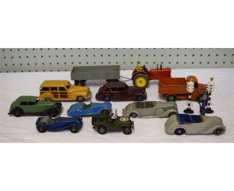 Fourteen unboxed Dinky Toys with some good early examples comprising two salon cars, five open top cars, jeep, two trailers, 