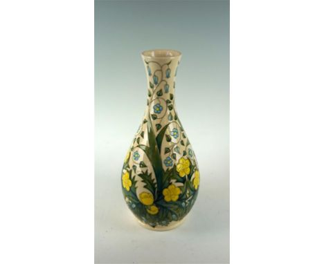 A modern Moorcroft vase of baluster form decorated with yellow and blue flowers on an ivory group, impressed factory marks an