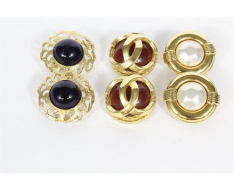 Chanel: Three pairs of vintage Chanel clip earrings, circa 1970-1985 to include a gold tone pair with central red section ove