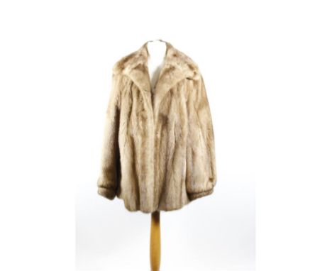 A circa 1970's blonde mink jacket, hip length with wide self lined collar, hook fastening to front, slip pockets and fully li