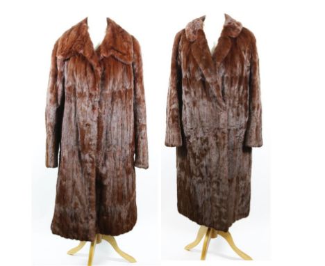 Two circa 1960's russet red ermine coats, both of three quarter length swing form, with self lined collars hook clasps and sl