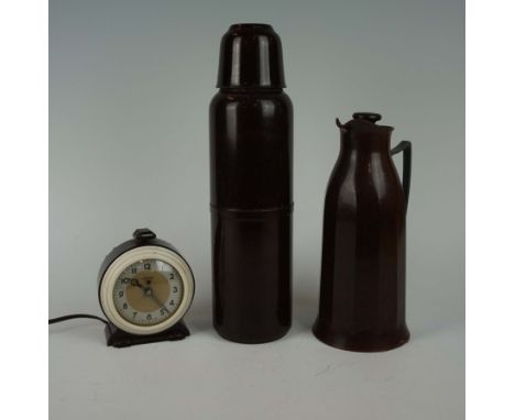 Three pieces of circa 1950s bakelite, to include a thermos flask, a Ferranti alarm clock, also a thermos flask hot water jug