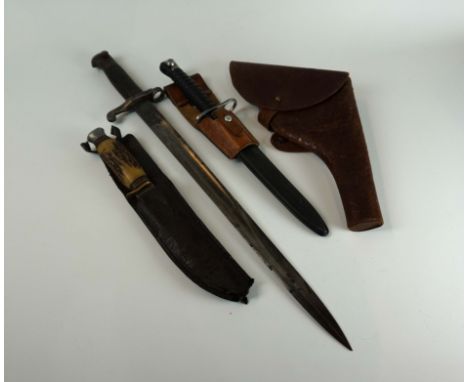 An 1886 Martini Henry bayonet, 46cm single edged single fullered blade, with checkered grips, a Swiss S.I.G 57 bayonet, 24cm 