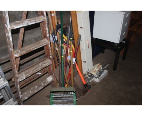 A quantity of long handled gardening tools