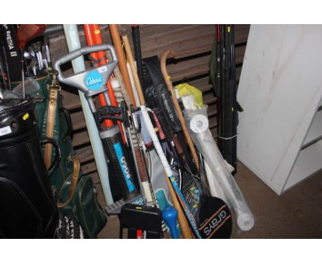 A large quantity of various tennis rackets; a PoGo stick; badminton rackets; squash rackets; hockey sticks etc.