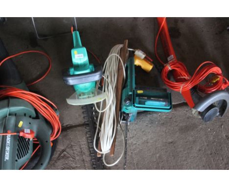 A Black and Decker electric chainsaw; together with an electric hedge trimmer