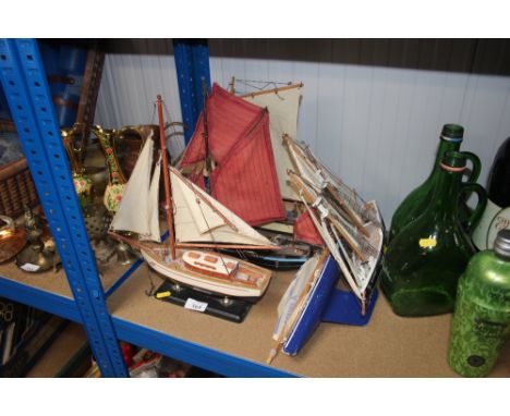 A quantity of model boats on stand