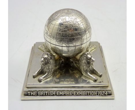 Silver inkwell in the form of a globe resting on 4 lions to commemmorate The British Empire Exhibition, 8cm sq. Birmingham 19