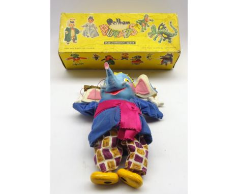 A boxed Elephant Pelham puppet with carved painted head, hands and feet with felt ears and jacket  Condition Report &amp; Fur