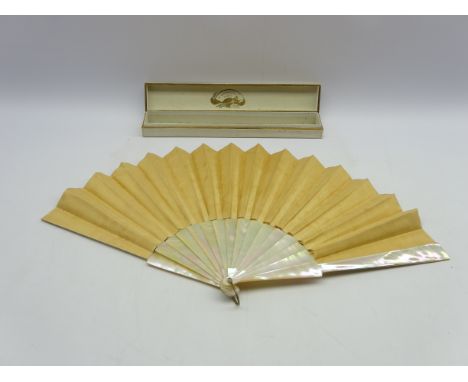 19th Century French fan with a classical figure in a garden setting signed 'Jolivett' with mother of pearl fingers, in a fan 
