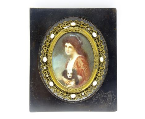 Oval miniature portrait of a girl holding a dog, seated half length, in an ebonised frame with stone set decoration, H9cm  Co