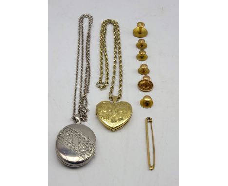 Gold heart shape locket on a gilt metal neck chain, 9ct gold tie pin, 6 9ct and 10ct gold dress studs and a silver locket. Co