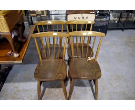 Set of four elm seated stick back chairs. Not available for in-house P&amp;P 