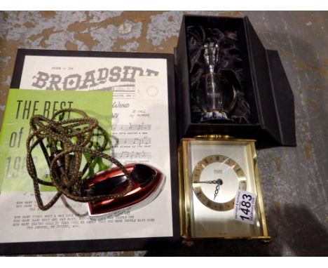 Mixed collectables to include brass carriage clock, boxed perfume bottle, horse brasses on strap. Not available for in-house 