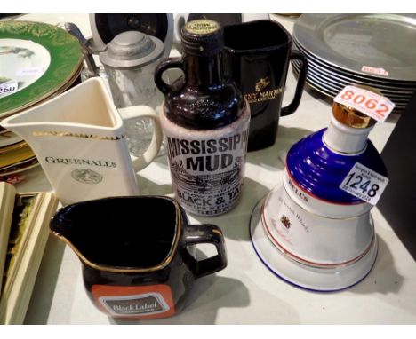 Six mixed ceramic and glass whisky jugs etc. Not available for in-house P&amp;P 