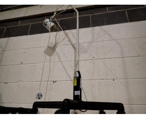 Adjustable lamp with wheeled base. All electrical items in this lot have been PAT tested for safety and have passed. This doe