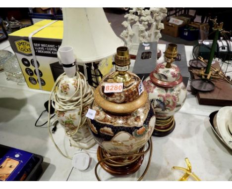 Four mixed table lamps. All electrical items in this lot have been PAT tested for safety and have passed. This does not confi