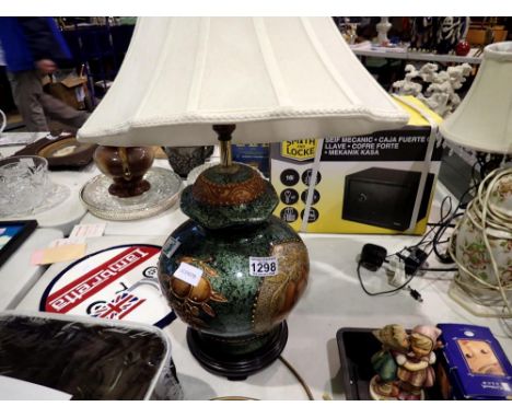 Large ceramic fruit patterned lamp with fabric shade. All electrical items in this lot have been PAT tested for safety and ha