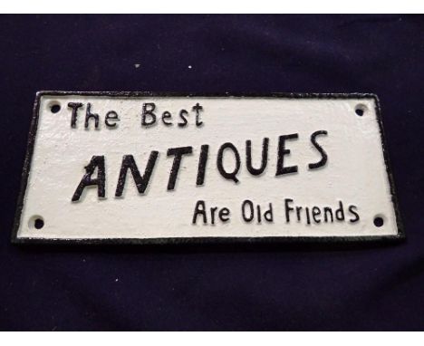 Cast iron The Best Antiques Are Old Friends sign, L: 28 cm. UK P&amp;P Group 1 (£16+VAT for the first lot and £2+VAT for subs