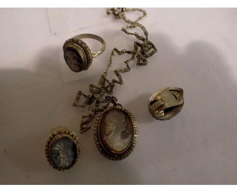 A suite of continental silver jewellery, each set with a carved abalone cameo, comprising pendant necklace, clip-on earrings 